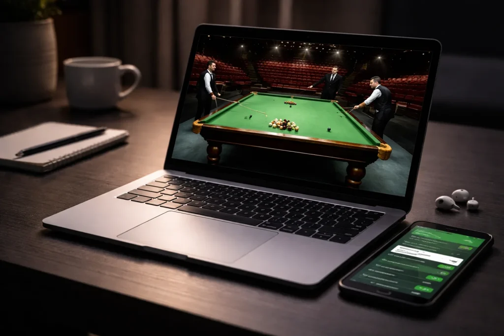 Snooker Live Stream auf einem Laptop neben einem Smartphone mit Wettplattform
