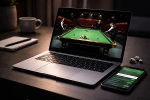 Snooker Live Stream auf einem Laptop neben einem Smartphone mit Wettplattform